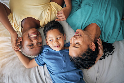 Buy stock photo Child, LGBT family and happy on bed in home bedroom for security, quality time and love. Adoption, lesbian or LGBTQ women or parents with a foster kid for care, fun and relax in morning from above