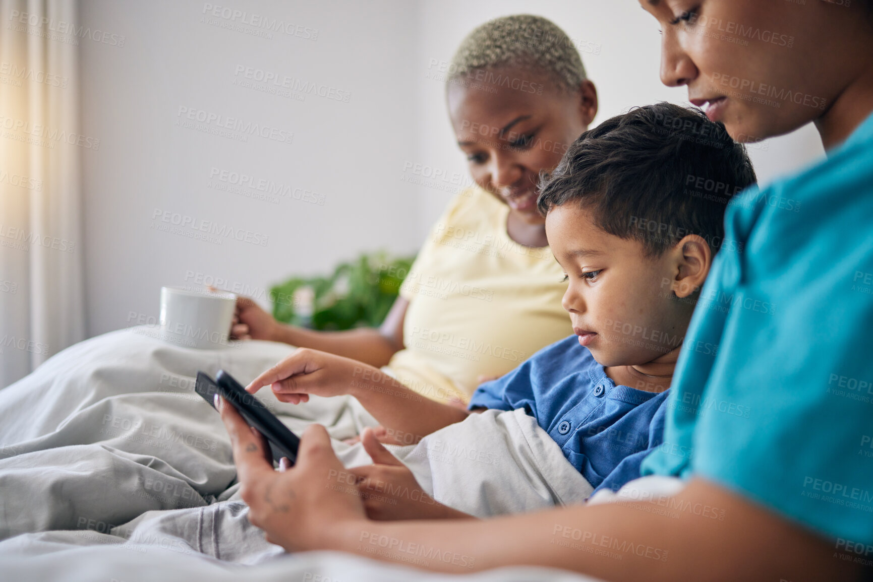 Buy stock photo Tablet, bed and gay mother, child and bisexual people reading online story, digital information and home ebook. LGBTQ, streaming video and queer mom, family or parents storytelling for kid in bedroom