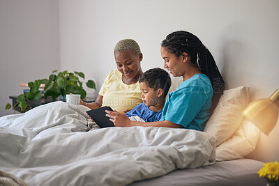 Buy stock photo Child, LGBT family and tablet in bed with internet in home bedroom for learning and education. Adoption, lesbian or gay women or parents with a foster kid and technology for online games or video