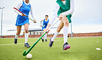 Sports, fitness and female hockey athletes playing game, match or tournament on an outdoor field. Equipment, exercise and young women training or practicing for strategy with stick and ball on pitch.