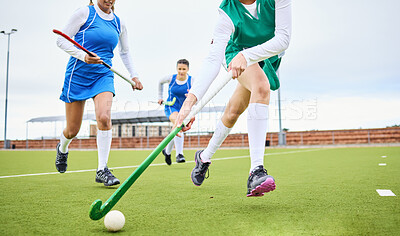 Buy stock photo Sports, fitness and female hockey athletes playing game, match or tournament on an outdoor field. Equipment, exercise and young women training or practicing for strategy with stick and ball on pitch.