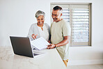 Happy senior couple, documents and laptop for budget planning, finance or expenses together at home. Elderly man and woman smile in happiness on computer for financial paperwork, bills or mortgage