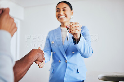 Buy stock photo Moving in, house keys and female realtor shaking hands for congratulations with homeowner clients. Happy, real estate and young woman agent doing a professional agreement handshake with people.