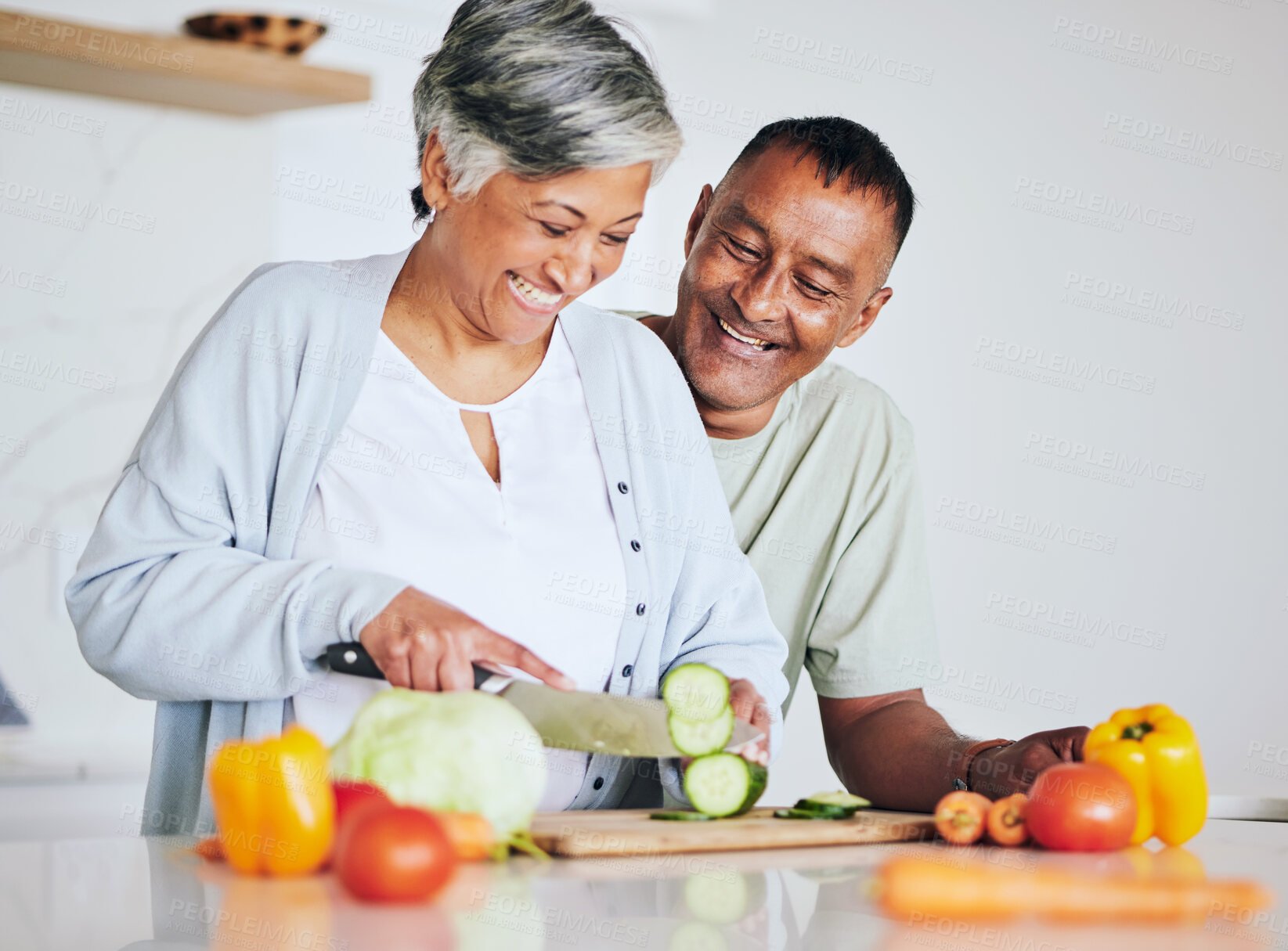 Buy stock photo Love, health and cooking with old couple in kitchen for food, lunch and helping. Wellness, nutrition and diet with senior man and woman cutting vegetables at home for retirement, dinner and relax