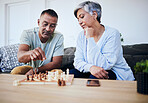Senior couple, chess match and home with thinking, strategy and mindset for brain power, relax and bonding. Elderly woman, man and sofa with board game, ideas and brainstorming for challenge in house