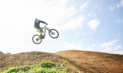 Buy stock photo Mountain bike, man and jump in sky for competition, freedom and off road adventure. Athlete, extreme sports and bicycle in air for action, cardio race and stunt power in nature, path and mockup space