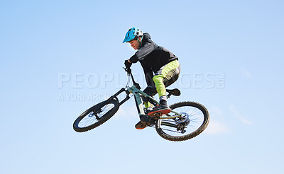 Buy stock photo Bicycle, man and jump in blue sky for competition, freedom and adventure with mockup space. Athlete, sports and bike in air for action, cardio race and courage for stunt performance, power or contest
