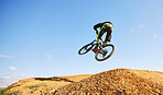 Bicycle, man and jump in air, dirt and outdoor for sports, race or adventure in summer, woods or nature. Extreme cycling, person and freedom for trail, mockup space or challenge for fitness in forest