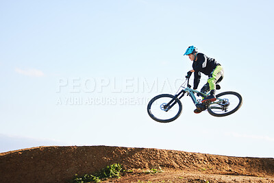 Buy stock photo Cycling, sports and man jump with bicycle for adrenaline on adventure, freedom and in air for speed. Mountain bike, tricks and cyclist for training, exercise and fitness on dirt road, trail and track