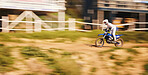 Race, motorcycle and extreme sports, man with speed for practice, training and action adventure. Fast professional dirt road biking, motion and biker in motorbike competition, performance and stunt.