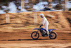 Sports, motorbike and man in the countryside for fitness, adrenaline and speed training outdoor. Dirt road, bike and male driver on motorcycle with freedom, performance and moto hobby stunt in nature