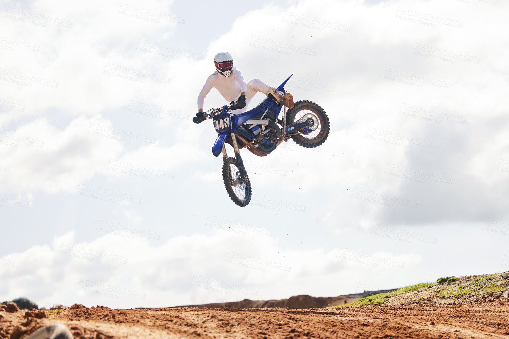 Buy stock photo Sports, jump and man on motorcycle with freedom, energy and power stunt in the countryside for training challenge. Off road, air and male jumping with motorbike for speed, performance or Moto action
