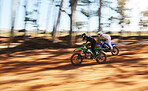 Race, motorbike and sports, men with speed for practice and training in fast action adventure. Professional dirt biking, motion and off road motorcycle competition, performance and challenge in woods