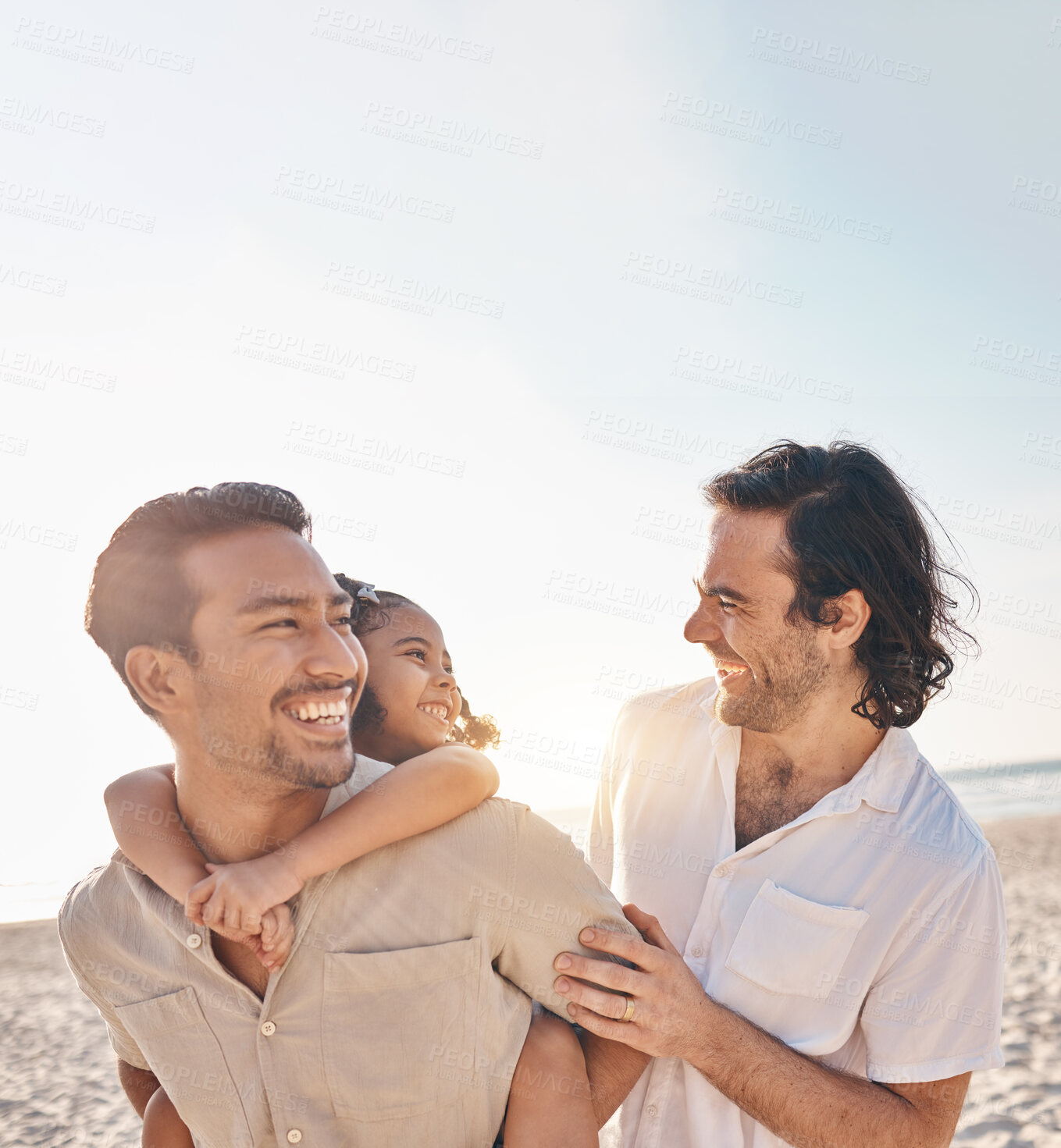 Buy stock photo Funny, piggyback and lgbt family at beach for love, care and a vacation in summer. Smile, interracial and gay parents laughing with child at sea during a holiday for bonding, travel or mockup space