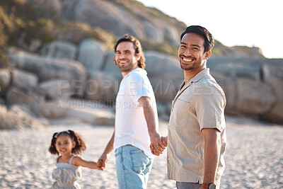 Buy stock photo Gay couple, portrait and holding hands with family at beach for seaside holiday, support and travel. Summer, vacation and love with men and child in nature for lgbtq, happiness and bonding together
