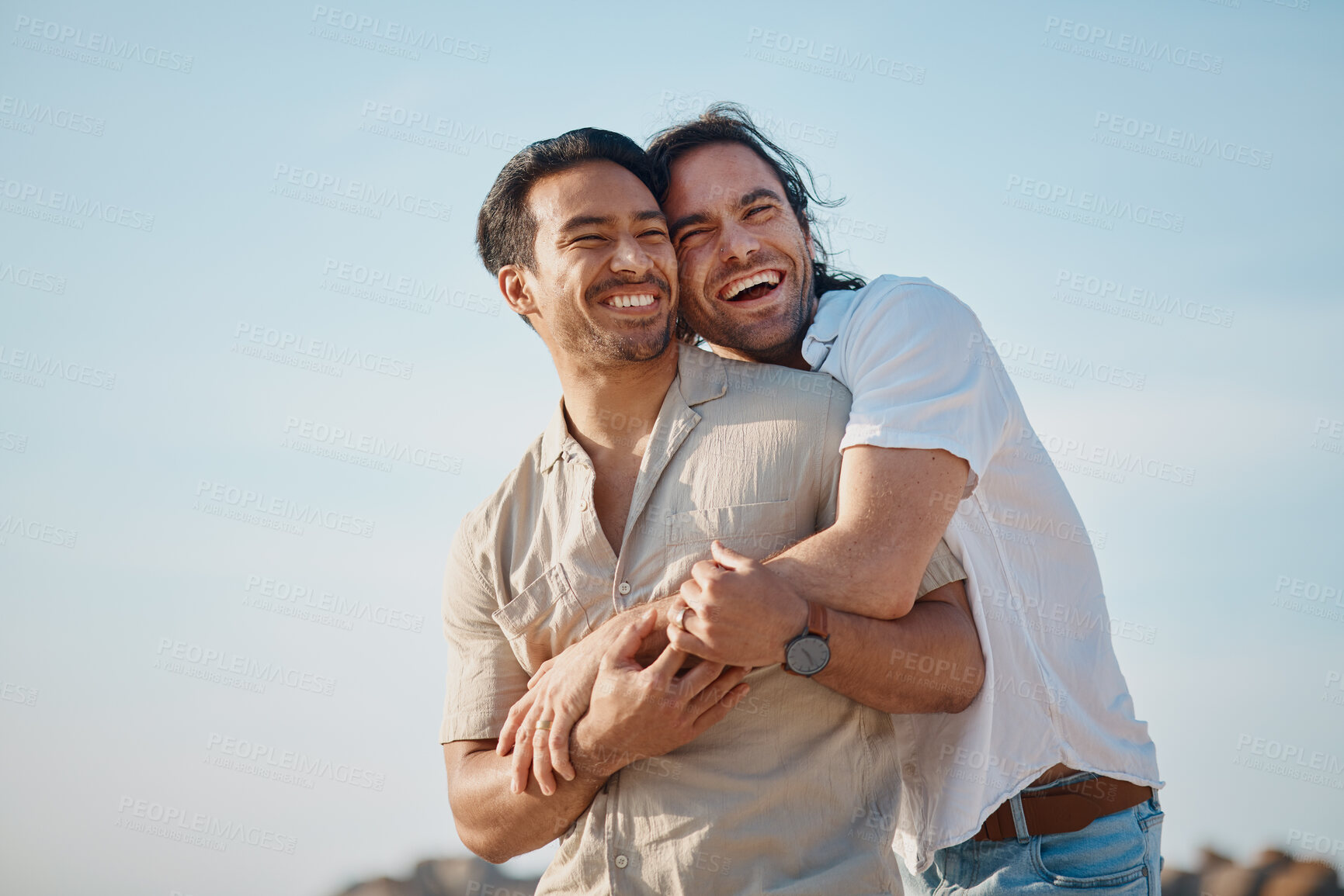 Buy stock photo Love, hug and gay men with blue sky, embrace and smile on summer vacation together in Thailand. Sunshine, romance and marriage, happy lgbt couple relax in nature on island holiday with pride and fun.