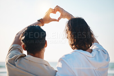Buy stock photo Love, heart hands and gay men on beach, hug from back on summer vacation together in Thailand. Sunshine, ocean and romance emoji, lgbt couple embrace in nature and holiday with pride, sea and fun.