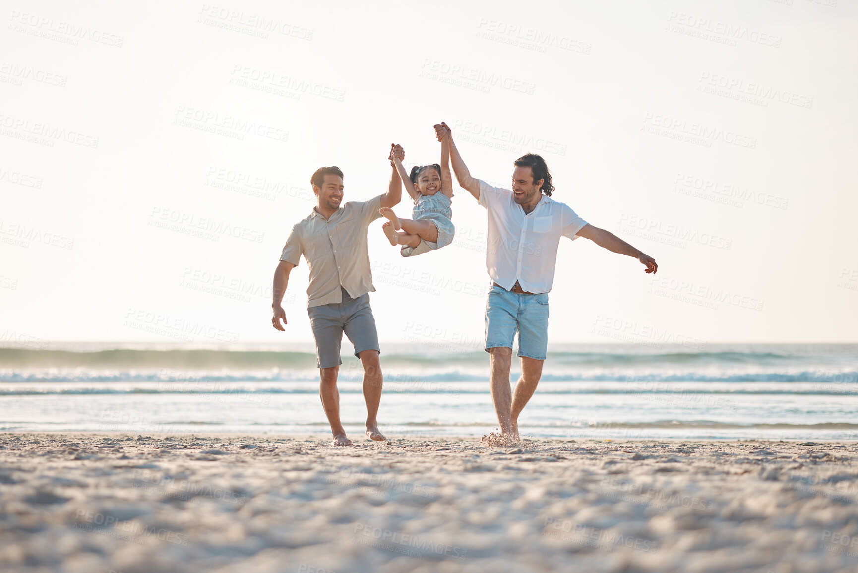 Buy stock photo Gay couple, swing and holding hands with family at beach for seaside holiday, support and travel. Summer, vacation and love with men and child in nature for lgbtq, happiness and bonding together