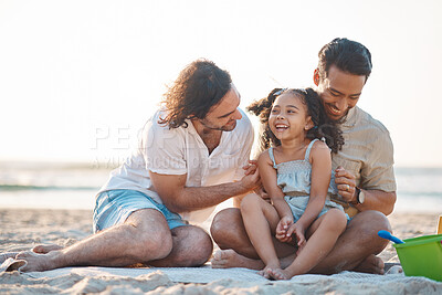 Buy stock photo Gay men, dad and girl at beach with love, bonding and care for vacation, laughing and outdoor in sunshine. LGBTQ couple, young child and adoption with family, holiday and comic conversation in summer