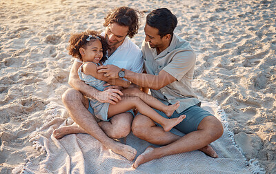 Buy stock photo Gay father, play and girl at beach with love, tickling or hug for vacation, laughing or outdoor in sunshine. LGBTQ parents, young kid and adoption with family, holiday or comic conversation in summer