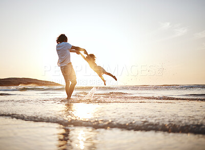 Buy stock photo Girl child, swing and father by ocean, sunset and speed for game, holding hands or waves in summer. Young female kid, dad and spin in air, sand or happy for family bonding, love or care in sunshine