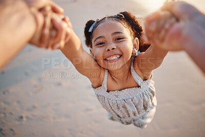 Buy stock photo Girl child, swing and pov at beach, portrait and smile for game, holding hands or speed in summer. Young female kid, parent and spin in air, sand or happy for family bonding, love or care in sunshine