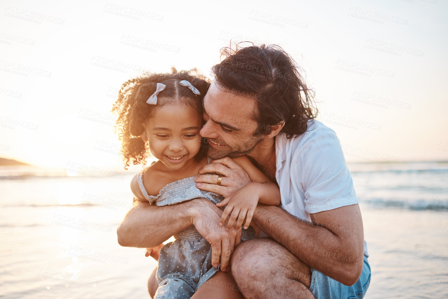 Buy stock photo Hug, happy and a child and father at the beach for holiday, care and love together after adoption. Summer, family and an interracial dad with a girl kid at the ocean for playing, travel or vacation