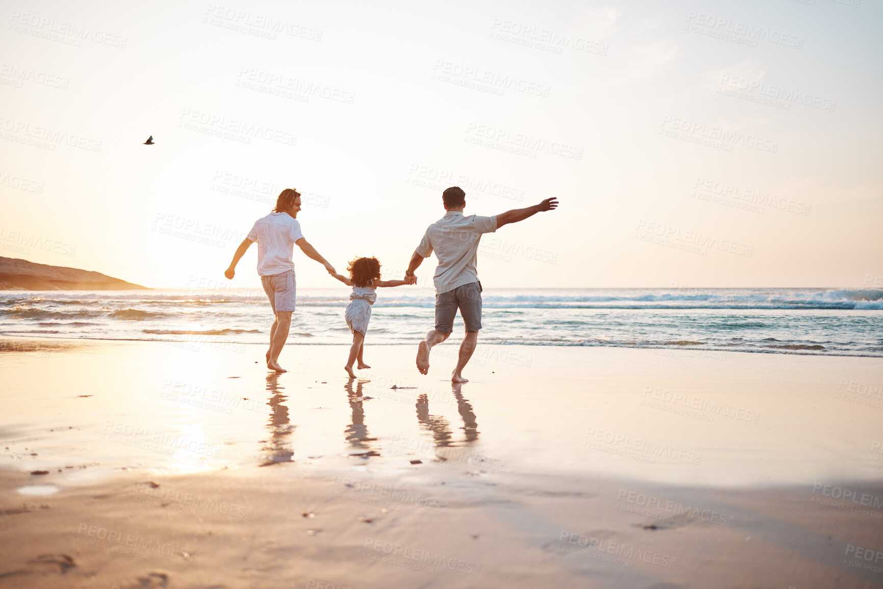 Buy stock photo Gay couple on beach, men and child, playing together and holding hands at sunset, running in waves on holiday. Love, happiness and sun, lgbt family on tropical ocean vacation and fun with daughter.
