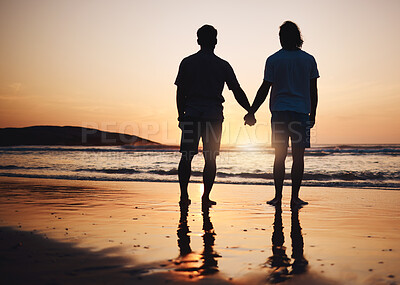 Buy stock photo Silhouette, holding hands and gay couple on beach, sunset and nature on summer vacation together in Thailand. Sunshine, ocean and romance, lgbt men on island and fun holiday with pride, sea and waves