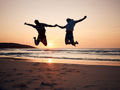 Buy stock photo Beach, sunset and silhouette of couple jump, holding hands and enjoy fun quality time together on summer holiday. Energy, ocean sea and excited man, woman or people celebrate Australia vacation