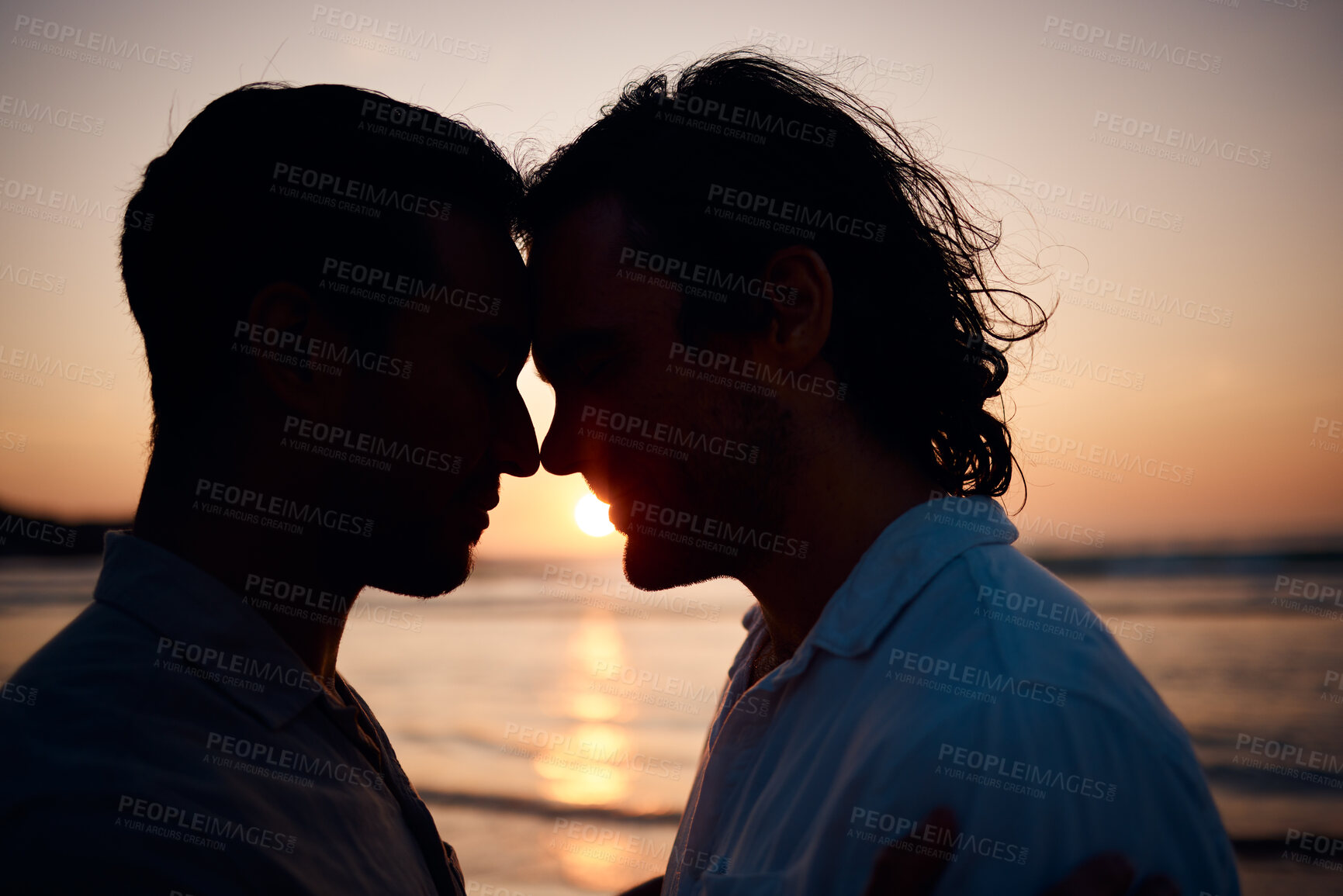 Buy stock photo Beach, sunset and gay couple in silhouette, embrace and love on summer island vacation together in Thailand. Sun, ocean and romance, lgbt men in nature and relax on holiday with pride, sea and light.