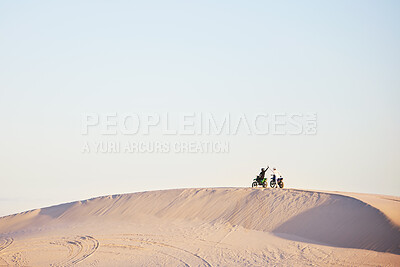 Buy stock photo Desert blue sky, motorbike and sports people high five, excited celebrate travel, teamwork or off road achievement. Motorcycle adventure, mockup winner or athlete driver collaboration on sand dunes