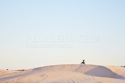 Buy stock photo Desert blue sky, motorbike and sports person celebrate travel, journey or off road adventure, freedom and victory. Motorcycle, mockup winner or athlete driver, racer or excited rider cheers on dunes