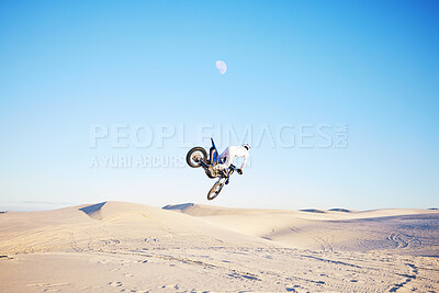 Buy stock photo Desert, motorbike jump or sports person travel, agile or driving on off road adventure, air freedom or bike journey. Motorcycle challenge, blue sky or extreme action driver, talent and skill training
