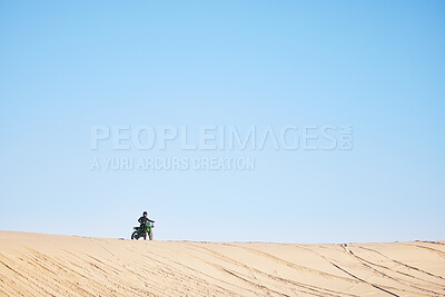 Buy stock photo Motorcycle race, desert and sand with space, blue sky background and outdoor for off road challenge in summer. Motorbike, person and dirt trail for performance, power and fast adventure for mockup