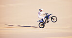 Bike, sand and mockup with a man in the desert for adrenaline, adventure or training in nature. Moto, sports and balance with a male athlete riding a motorcycle for freedom or fitness on space