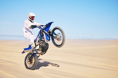 Buy stock photo Bike, sand and motion blur with a man in the desert for adrenaline, adventure or training in nature. Energy, speed and balance with a male sports athlete riding a motorcycle in a remote location 