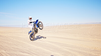 Buy stock photo Desert, motorbike and sports person travel, journey and driving on off road adventure, freedom and balance on bike. Motorcycle, extreme action or athlete driver, racer or rider training on sand dunes