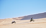 Bike, sand and race with people in the desert for adrenaline, adventure or training in nature. Sports, energy and freedom with friends in a remote location for a motorcycle competition in Dubai