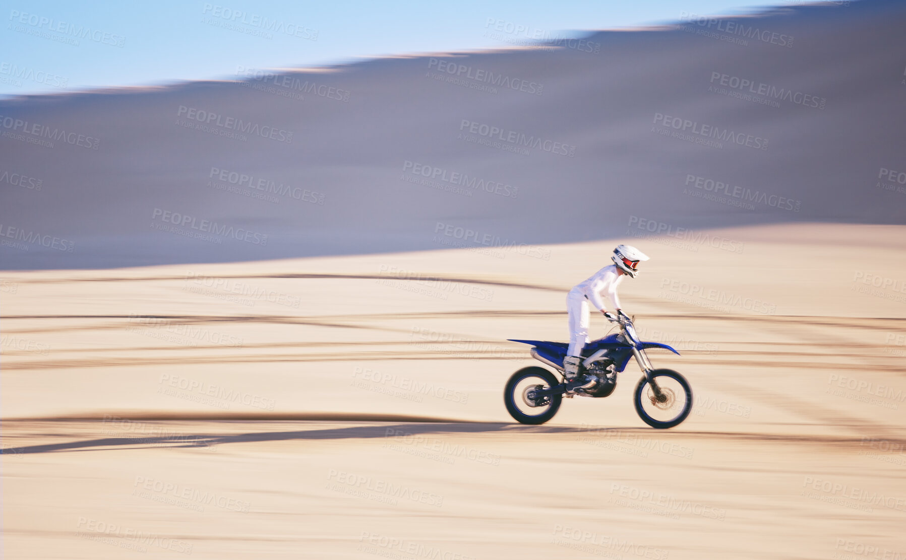 Buy stock photo Bike, training and space with a man in the desert for fitness or an adrenaline hobby for freedom. Motorcycle, sports and summer with a male athlete riding a vehicle in Dubai for energy or balance