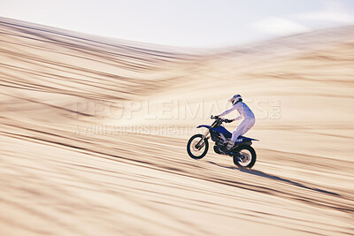 Buy stock photo Motorcycle, sports and space with a man in the desert for fitness or an adrenaline hobby for freedom. Bike, training and summer with a male athlete riding a vehicle in Dubai for energy or balance