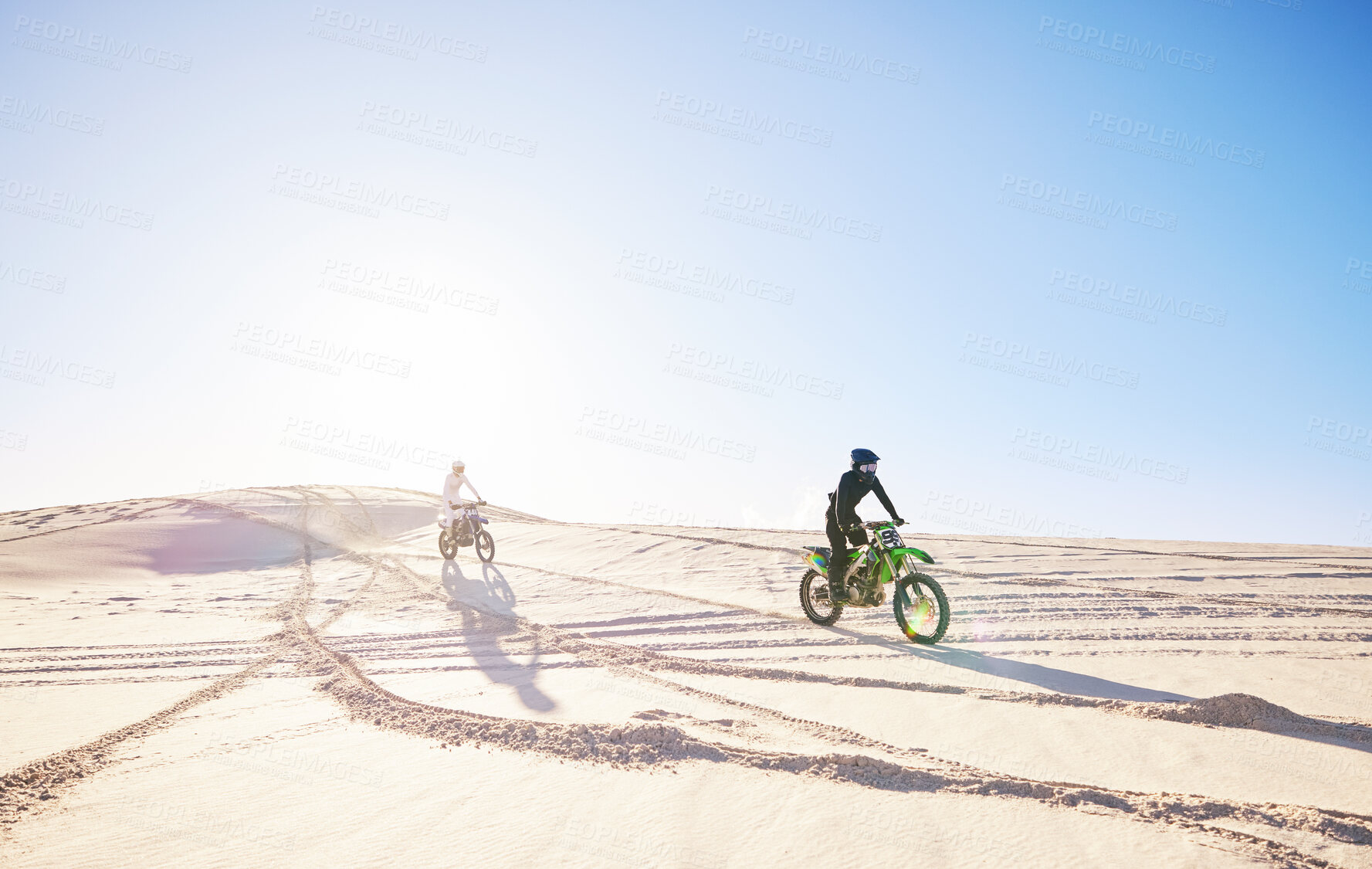 Buy stock photo Bike, sports and race with people in the desert for fitness or an adrenaline hobby for freedom. Motorcycle, training and summer with athlete friends riding a vehicle in Dubai for energy or balance