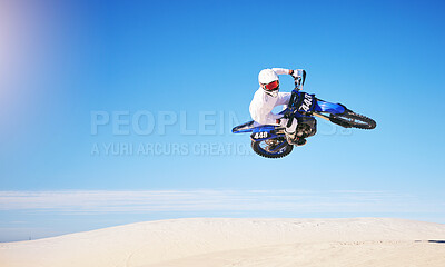 Buy stock photo Race, motorbike jump and person in desert, action and extreme sport with speed outdoor and mockup space. Adventure, fitness and blue sky, motorcycle jump stunt and freedom, challenge and performance