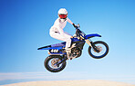 Blue sky, motorbike in air and person with action and extreme sport, speed outdoor and mockup space. Adventure, fitness and training, motorcycle jump stunt and freedom, challenge and performance