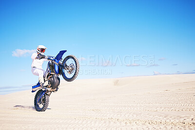 Buy stock photo Bike, mockup and balance with a man in a desert for fitness or an adrenaline hobby on space. Motorcycle, skill and summer with a male sports athlete riding a vehicle in Dubai for freedom or energy