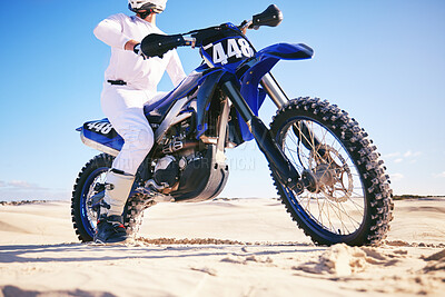 Buy stock photo Sand, sports and man with motorbike in desert for adrenaline, adventure and freedom. Competition, extreme action and male person on bike on dunes for training, exercise and race for driving challenge