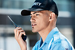 Walkie talkie, security guard and man in city in discussion, thinking or communication. Safety, protection or officer on radio to chat on technology in police law enforcement service in urban outdoor