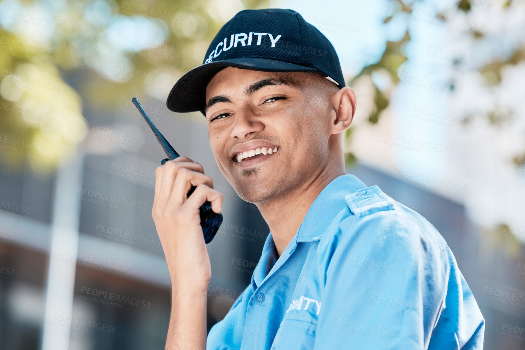 Buy stock photo Walkie talkie, man and security guard in portrait in city, conversation or communication. Safety, face and happy officer on radio to chat on technology in police surveillance service in urban outdoor