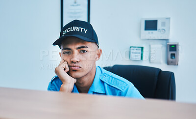 Buy stock photo Portrait, surveillance and a bored man security guard sitting at a desk in his office to serve and protect. CCTV, safety and control with a tired officer working as a private service employee