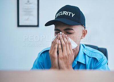 Buy stock photo Man, blowing nose and working at desk in office for security, safety or surveillance control room or person with allergies or hayfever. Sick, guard and employee with flu, virus or tissue for sneeze